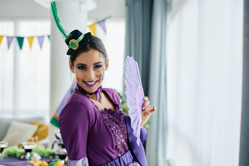 Young beautiful woman in carnival costume during Mardi Gras festival.